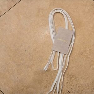 Luxurious white shoelaces by Jimmy Choo.